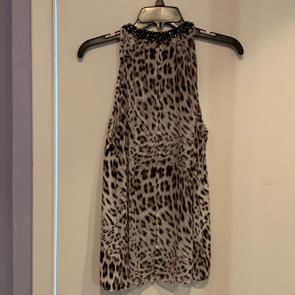 Jennifer Lopez leopard print sleeveless blouse